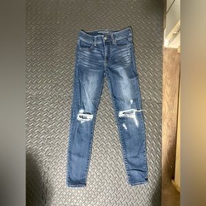 Women’s AE high rise jeggings with 2 patched rips size 0 short